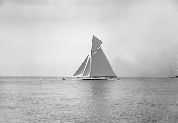 The 19-metre cutter Norada sailing in gentle winds, 1911. Creator: Kirk & Sons of Cowes