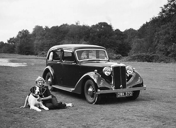 1938 Daimler DB18 with lady and her pet dog. Creator: Unknown