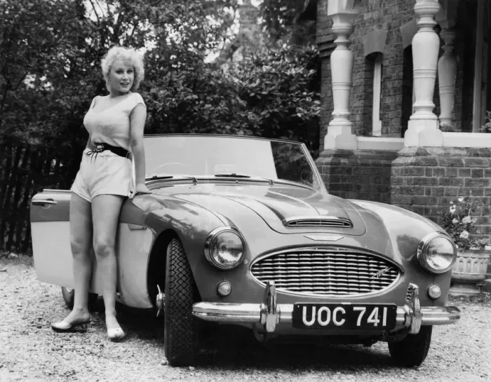 Framed Print : 1957 Austin - Healey 100-6 with model. Creator: Unknown Framed Print : 1957 Austin - Healey 100-6 with model. Creator: Unknown