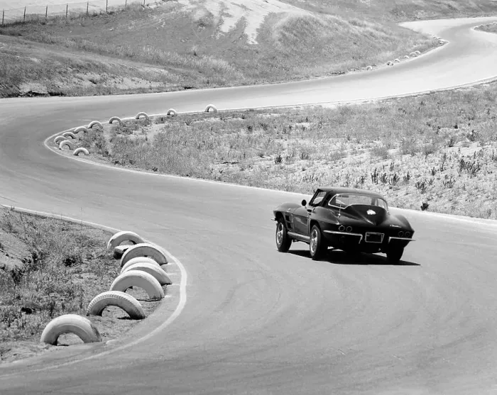 Framed Print : 1964 Chevrolet Corvette Stingray on a winding racetrack, (c1964?) Framed Print : 1964 Chevrolet Corvette Stingray on a winding racetrack, (c1964?)