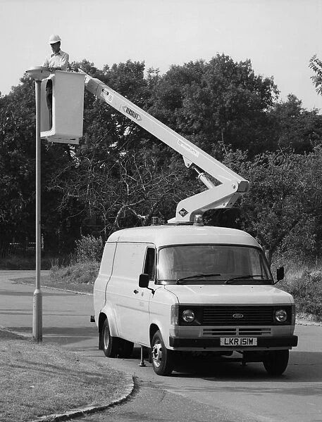 1981 Ford Transit 190 van with extending boom. Creator: Unknown
