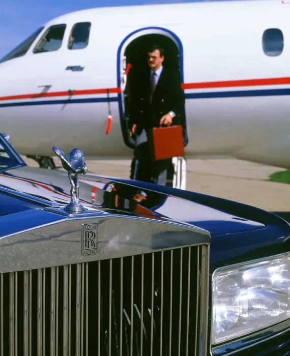 Framed Print : 1987 Rolls Royce Silver Spirit with executive disembarking jet