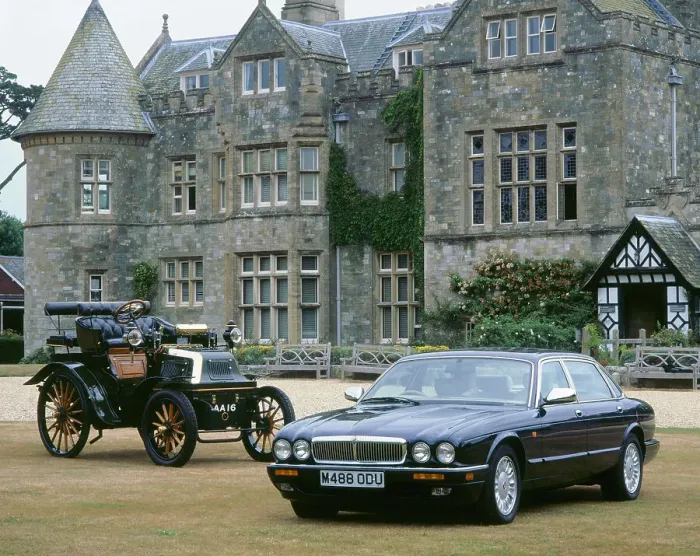 Framed Print : 1995 Daimler Double six with 1899 Daimler outside Palace House Framed Print : 1995 Daimler Double six with 1899 Daimler outside Palace House