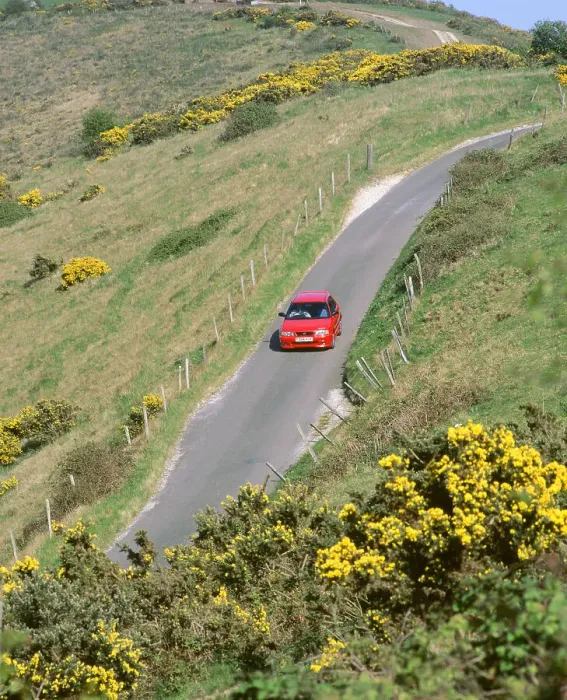 Framed Print : 1996 Suzuki Baleno GS Sport on winding country lane, Dorset Framed Print : 1996 Suzuki Baleno GS Sport on winding country lane, Dorset