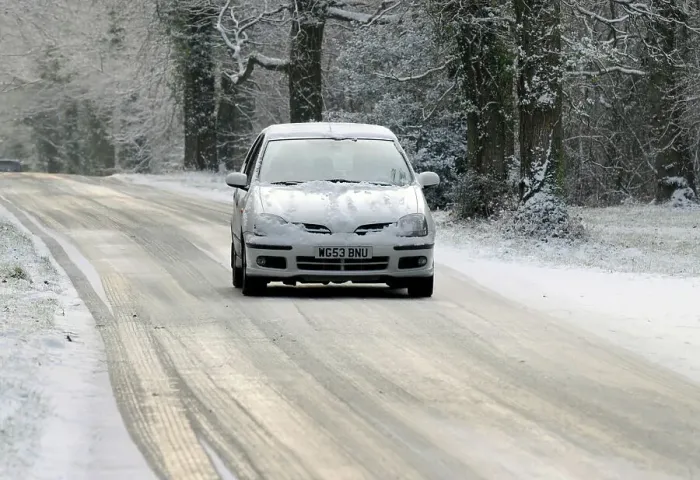 Framed Print : 2003 Nissan Almera driving on icy road in winter Framed Print : 2003 Nissan Almera driving on icy road in winter