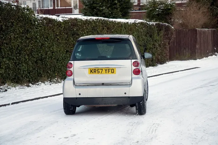 Framed Print : 2007 Smart car sliding on snowy road Framed Print : 2007 Smart car sliding on snowy road
