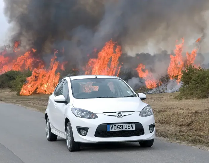 Framed Print : 2010 Mazda 2 Sport, controlled burning in New Forest Framed Print : 2010 Mazda 2 Sport, controlled burning in New Forest
