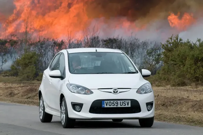 Framed Print : 2010 Mazda 2 Sport, controlled burning in New Forest