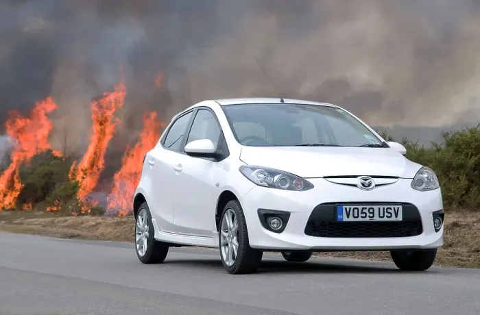 Framed Print : 2010 Mazda 2 Sport, controlled burning in New Forest Framed Print : 2010 Mazda 2 Sport, controlled burning in New Forest