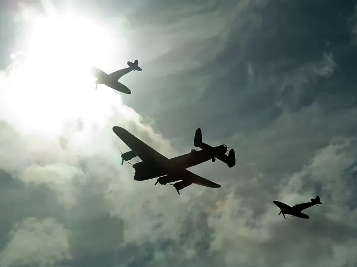 Framed Print : 2011 Goodwood Revival Meeting, Lancaster bomber and 2 Spitfires in aerial display