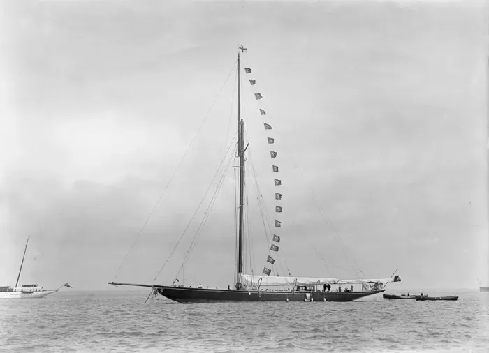 Framed Print : The 221 ton cutter Britannia at anchor with prize flags, 1921 Framed Print : The 221 ton cutter Britannia at anchor with prize flags, 1921