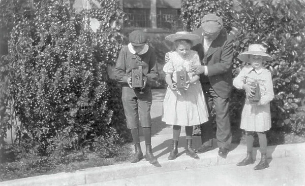 3 children sighting box cameras, c1905. Creator: Frances Benjamin Johnston