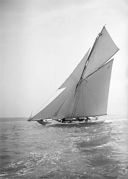 The 40-rater cutter Carina sailing close-hauled, 1911. Creator: Kirk & Sons of Cowes