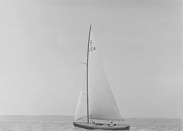 The 6 Metre class Sheila (US4) sailing upwind, 1921. Creator: Kirk & Sons of Cowes