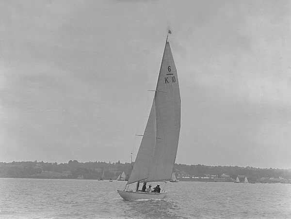 The 6 Metre yacht Polly (K10) sailing upwind, 1921. Creator: Kirk & Sons of Cowes