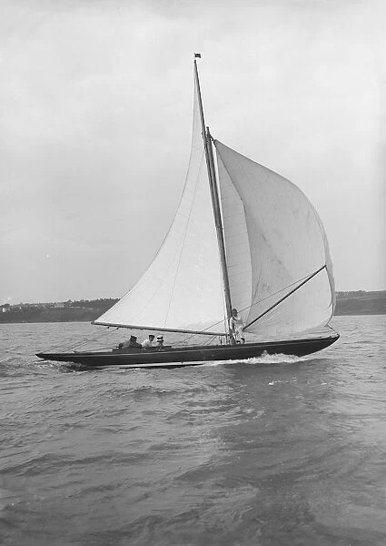 The 7 Metre Anitra (K4) sailing with spinnaker, 1913. Creator: Kirk & Sons of Cowes