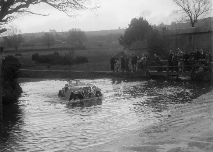 Framed Print : 972 cc Singer Le Mans driving through a ford during a motoring trial, 1936. Artist: Bill Brunell Framed Print : 972 cc Singer Le Mans driving through a ford during a motoring trial, 1936. Artist: Bill Brunell