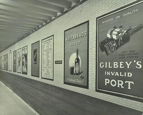 Advertisements for beer and port, Holborn Underground Tram Station, London, 1931