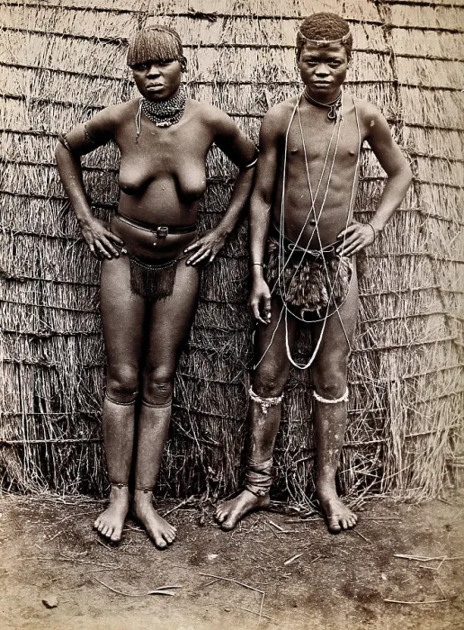 Framed Print : Africa: an African woman and man in front of a kraal hut, 19th century. Creator: Unknown Framed Print : Africa: an African woman and man in front of a kraal hut, 19th century. Creator: Unknown