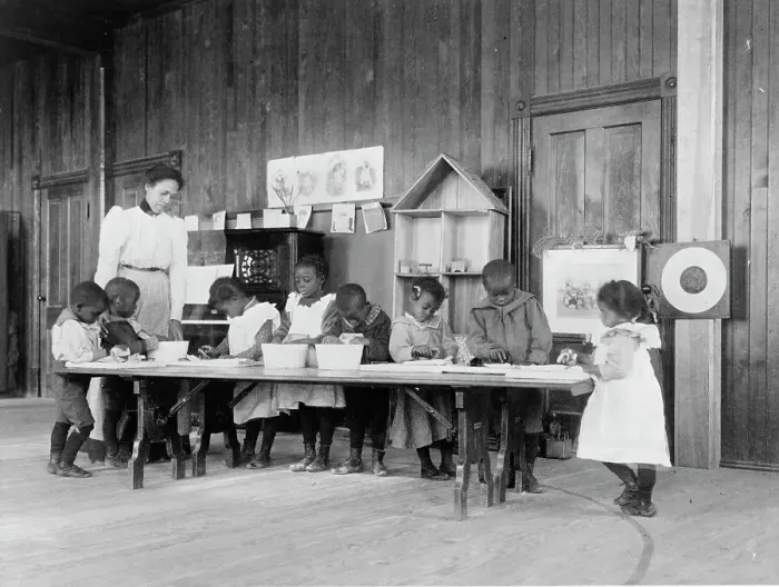 Framed Print : Eight African American children, in kindergarten, learning washing and ironing... 1899 or 1900. Creator: Frances Benjamin Johnston Framed Print : Eight African American children, in kindergarten, learning washing and ironing... 1899 or 1900. Creator: Frances Benjamin Johnston