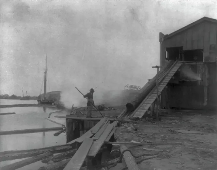 Framed Print : African American guiding log from water onto saw mill ramp, Newport News, Va. 1900, 1899 or 1900. Creator: Frances Benjamin Johnston Framed Print : African American guiding log from water onto saw mill ramp, Newport News, Va. 1900, 1899 or 1900. Creator: Frances Benjamin Johnston
