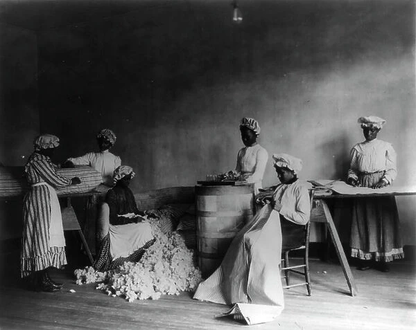 African American students in mattress-making class, Tuskegee Institute, Tuskegee, Alabama, 1902. Creator: Frances Benjamin Johnston