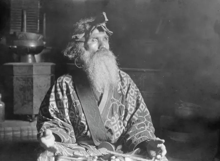 Framed Print : Ainu chief wearing a headdress seated with a sword in his lap, 1908. Creator: Arnold Genthe Framed Print : Ainu chief wearing a headdress seated with a sword in his lap, 1908. Creator: Arnold Genthe
