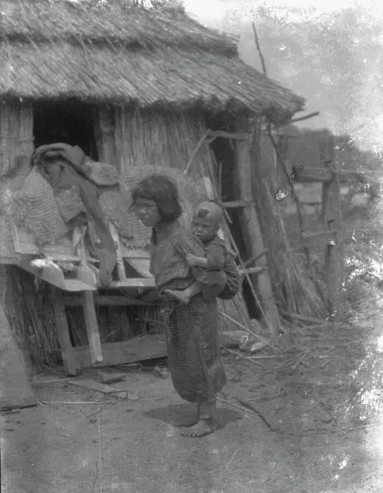 Framed Print : Ainu child carrying a baby on back, 1908. Creator: Arnold Genthe Framed Print : Ainu child carrying a baby on back, 1908. Creator: Arnold Genthe
