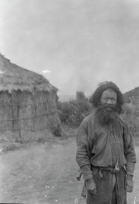 Framed Print : Ainu man standing outside, 1908. Creator: Arnold Genthe Framed Print : Ainu man standing outside, 1908. Creator: Arnold Genthe