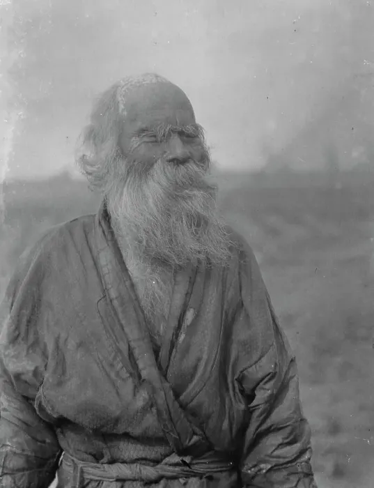 Framed Print : Ainu man standing outside, 1908. Creator: Arnold Genthe Framed Print : Ainu man standing outside, 1908. Creator: Arnold Genthe
