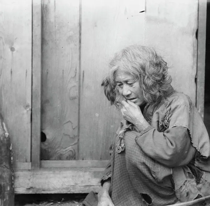 Framed Print : Ainu woman seated by the door of a wooden hut, 1908. Creator: Arnold Genthe Framed Print : Ainu woman seated by the door of a wooden hut, 1908. Creator: Arnold Genthe