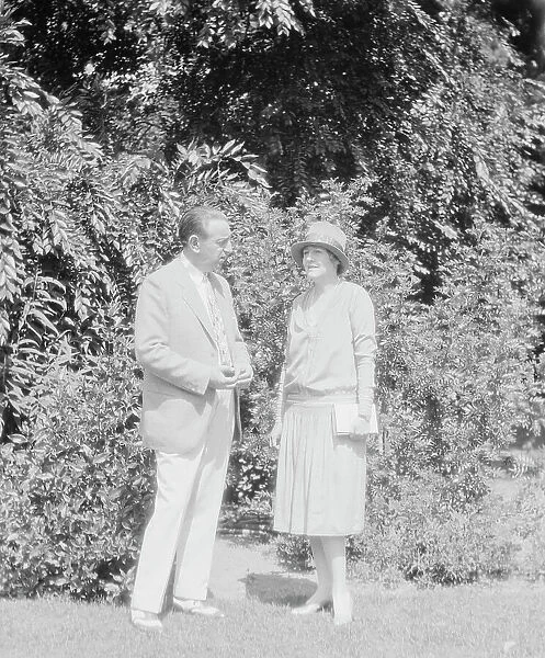 Alanson, Bertram, Mr. and Mrs. standing outdoors, between 1927 and 1937. Creator: Arnold Genthe