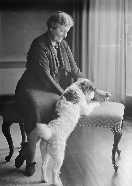 Alanson, Bertram, Mrs. with dog, portrait photograph, between 1927 and 1937. Creator: Arnold Genthe