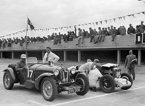 Alfa Romeo and supercharged MG Midget on the start line at Brooklands, 1938 or 1939
