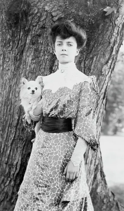 Framed Print : Alice Roosevelt Longworth, three-quarter length portrait, standing in front of tree...dog, c1902. Creator: Frances Benjamin Johnston Framed Print : Alice Roosevelt Longworth, three-quarter length portrait, standing in front of tree...dog, c1902. Creator: Frances Benjamin Johnston