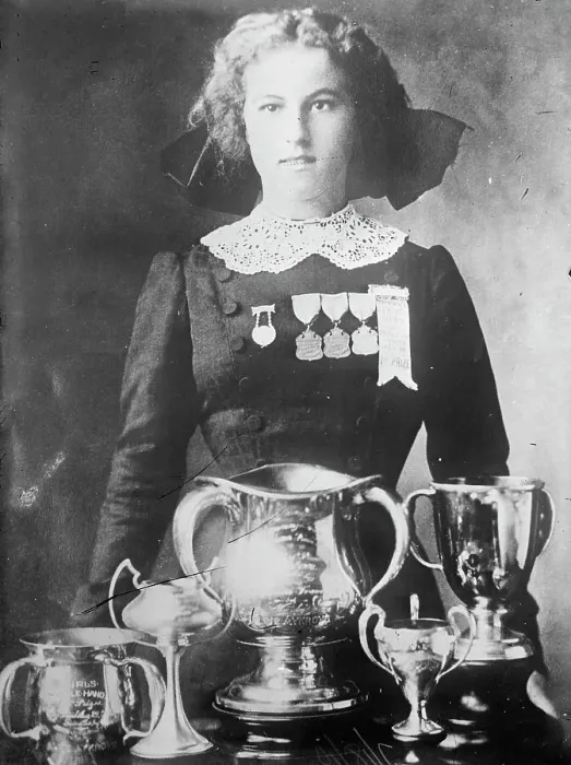 Framed Print : Alsie Aykroyd in front of her trophies, 1910. Creator: Bain News Service