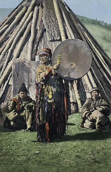 Altai Shaman with Tambourine in Front of a Traditional Dwelling (Chaadyr), 1911-1913. Creator: Sergei Ivanovich Borisov