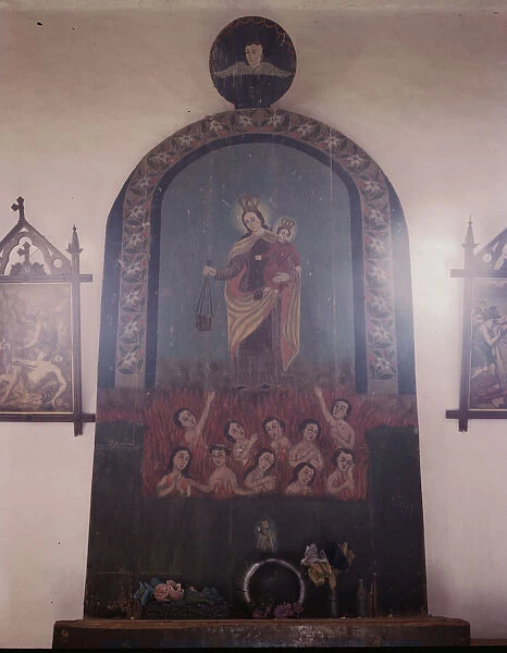 The altar of Nuestra Senora del Carmel on the south wall of the church, Trampas, N.M. 1943. Creator: John Collier
