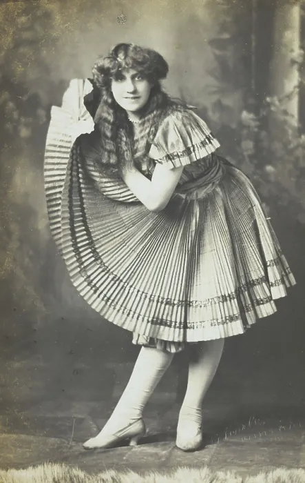 Framed Print : An amateur actor in drag holds up his impressive folded dress to one side, (between 1910 and 1919?). Creator: Unknown Framed Print : An amateur actor in drag holds up his impressive folded dress to one side, (between 1910 and 1919?). Creator: Unknown
