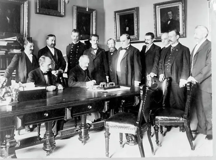 Framed Print : Ambassador Cambon signing the Peace Protocol, c1898. Creator: Frances Benjamin Johnston Framed Print : Ambassador Cambon signing the Peace Protocol, c1898. Creator: Frances Benjamin Johnston