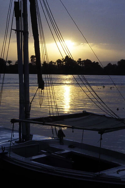 An anchored felucca on the River Nile at sunset