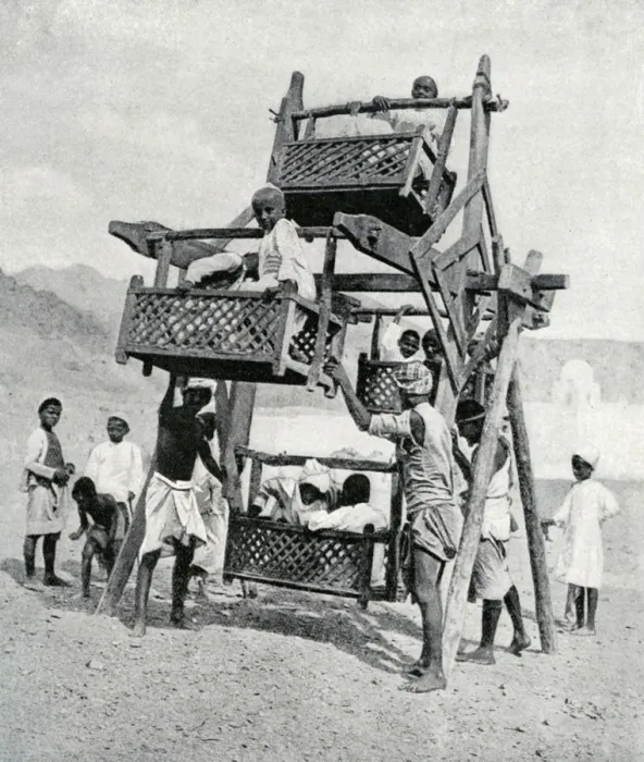 Framed Print : Arabian children enjoying a big-wheel, 1922 Framed Print : Arabian children enjoying a big-wheel, 1922