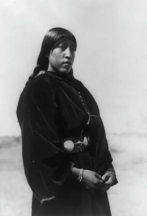 Framed Print : Arapaho maiden, three-quarter-length portrait, standing, facing right, c1910. Creator: Edward Sheriff Curtis Framed Print : Arapaho maiden, three-quarter-length portrait, standing, facing right, c1910. Creator: Edward Sheriff Curtis
