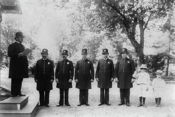 Archie and Quentin Roosevelt with White House policemen, c1902 June 17. Creator: Frances Benjamin Johnston