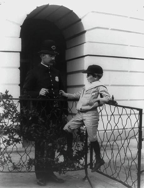 Archie Roosevelt and his friend the policeman, c1902. Creator: Frances Benjamin Johnston