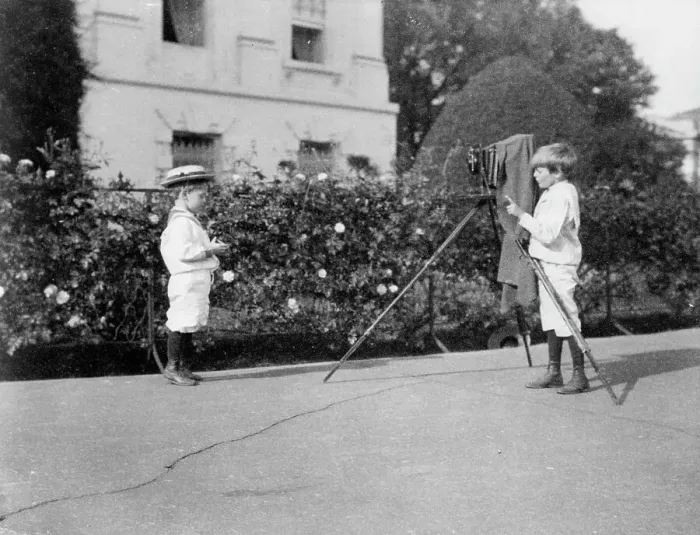 Framed Print : Archie Roosevelt photographing Quentin Roosevelt outdoors, 1902. Creator: Frances Benjamin Johnston Framed Print : Archie Roosevelt photographing Quentin Roosevelt outdoors, 1902. Creator: Frances Benjamin Johnston