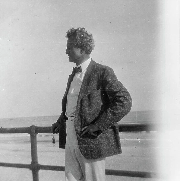 Arnold Genthe at the beach, between 1896 and 1942. Creator: Arnold Genthe