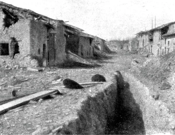 Aspects du champ de bataille de Verdun; route traversant le village dispute de Cumieres... 1916. Creator: Unknown
