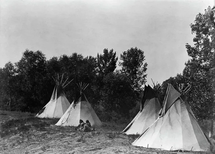 Framed Print : An Assiniboin camp containing four tepees with Indians seated on ground, c1908. Creator: Edward Sheriff Curtis Framed Print : An Assiniboin camp containing four tepees with Indians seated on ground, c1908. Creator: Edward Sheriff Curtis