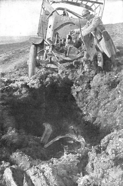 Au Volant; Camion demoli, pres de Verdun, par un obus de 210: le radiateur detache est... 1916. Creator: Unknown